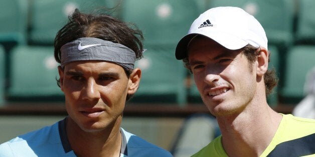 Great Britain's Andy Murray (R) poses next to Spain's Rafael Nadal prior to their French tennis Open semi-final match at the Roland Garros stadium in Paris on June 6, 2014. AFP PHOTO / KENZO TRIBOUILLARD (Photo credit should read KENZO TRIBOUILLARD/AFP/Getty Images)