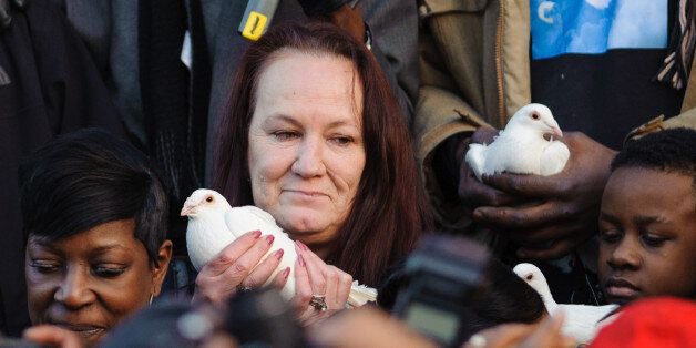 Mother of Mark Duggan, prepares to release a white dove at a vigil in his memory