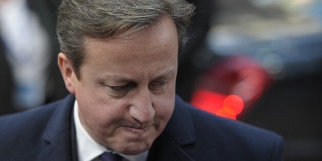 British Prime Minister David Cameron arrives to take part in an EU summit focused on the common security, Defence policy and Economic and Monetary union, in Brussels on December 19, 2013. The European Union took a historic leap towards greater integration just hours ahead of a summit today, with a deal on a banking union to prevent a re-run of the eurozone's recent crisis. AFP PHOTO / ALAIN JOCARD (Photo credit should read ALAIN JOCARD/AFP/Getty Images)