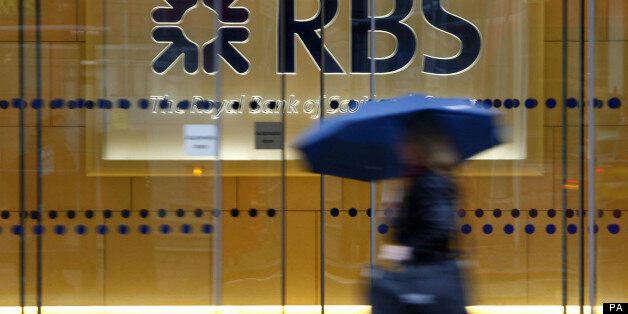 File photo dated 03/12/09 of a woman walking past the headquarters of the Royal Bank of Scotland in the City of London as the bank is reportedly poised to name insider Ross McEwan, its head of retail banking, as successor to chief executive Stephen Hester.