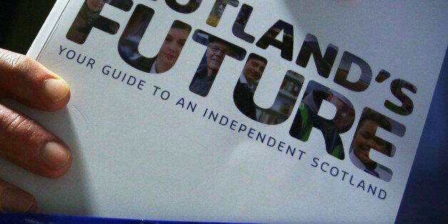 File photo dated 26/11/13 of a person holding the Scottish Government's white paper on independence as two-thirds of Scots find it difficult to decide if information provided ahead of the independence referendum is true or not, a new poll has found.