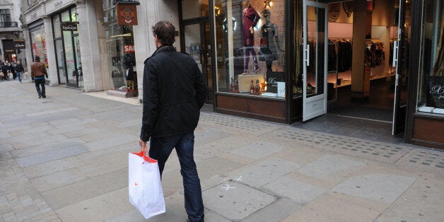 Last minute Christmas shoppers in London's Regent Street this morning, where there was only a handful of customers.