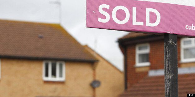 File photo dated 02/10/2012 of a general view of an estate agent's 'Sold' sign outside a property, as house prices increased at their fastest rate in three years in July in further signs of a market revival, Nationwide has reported.