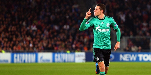 Schalke's midfielder Julian Draxler celebrates after scoring during the UEFA Champions League group E football match FC Schalke 04 vs FC Basel 1893 in Gelsenkirchen, Germany, on December 11, 2013. AFP PHOTO / PATRIK STOLLARZ (Photo credit should read PATRIK STOLLARZ/AFP/Getty Images)