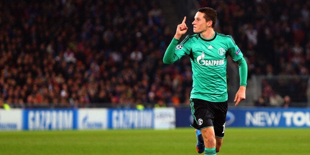 Schalke's midfielder Julian Draxler celebrates after scoring during the UEFA Champions League group E football match FC Schalke 04 vs FC Basel 1893 in Gelsenkirchen, Germany, on December 11, 2013. AFP PHOTO / PATRIK STOLLARZ (Photo credit should read PATRIK STOLLARZ/AFP/Getty Images)