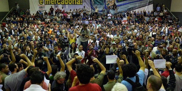 Metro workers meeting at their union headquarters in Sao Paulo, Brazil on June 11, 2014 during the session where they decided the end of their strike, on the eve of the opening match of the FIFA World Cup 2014. AFP PHOTO / NELSON ALMEIDA (Photo credit should read NELSON ALMEIDA/AFP/Getty Images)