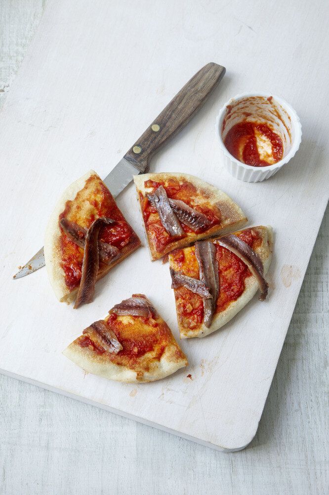Flatbread with garlicky tomato sauce and anchovies