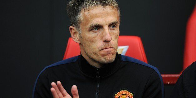 Manchester United coach Phil Neville before the match