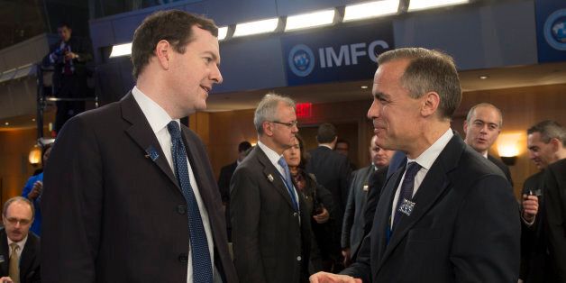 Governor of the Bank of England Mark Carney (R) talks with British Finance Minister George Osborne (L) during annual IMF/World Bank meetings in Washington, DC, October 12, 2013. AFP PHOTO / Jim WATSON (Photo credit should read JIM WATSON/AFP/Getty Images)