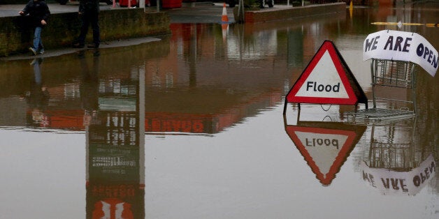 UPTON UPON SEVERN, UNITED KINGDOM - JANUARY 04: A flood sign warns besides a petrol station close to the River Severn at Upton upon Severn is seen on January 4, 2014 in Worcestershire, England. After a period of recent storms and heavy rain, forecasters are warning that there is still more bad weather to come over the next few days. (Photo by Matt Cardy/Getty Images)