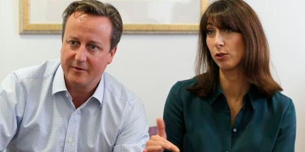 Prime Minister David Cameron and his wife Samantha talk to cancer patients during a visit to the John Radcliffe Hospital in Oxford.