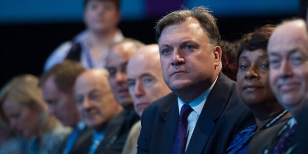 Shadow chancellor Ed Balls listens to his wife, shadow home secretary Yvette Cooper address the Labour Party conference in Brighton today.