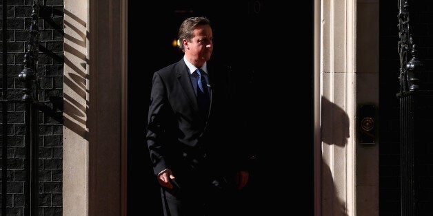 LONDON, ENGLAND - MAY 14: Prime Minister David Cameron waits to greet Palestinian President Mahmoud Abbas to Downing Street on May 14, 2014 in London, England. Mr Abbas is to meet US Secretary of State John Kerry in London tomorrow as peace talks between Israel and Palestine continue. (Photo by Dan Kitwood/Getty Images)