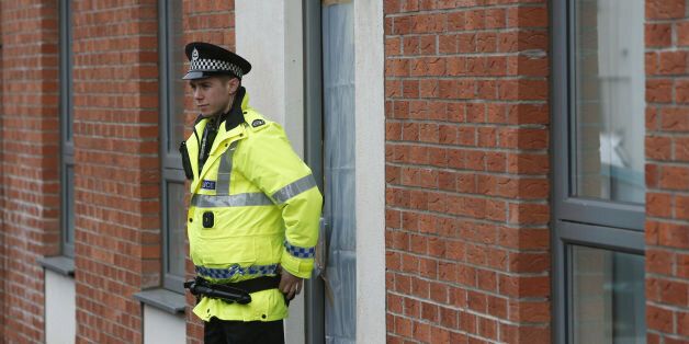 A police officer guards an address in Edinburgh