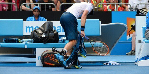 Andy Murray of Britain smashes his racket against the ground during his game against Stephane Robert of France during their men's singles match on day eight of the 2014 Australian Open tennis tournament in Melbourne on January 20, 2014. IMAGE RESTRICTED TO EDITORIAL USE - STRICTLY NO COMMERCIAL USE AFP PHOTO / WILLIAM WEST (Photo credit should read WILLIAM WEST/AFP/Getty Images)