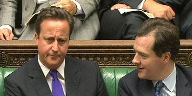 Prime Minister David Cameron listens to Chancellor George Osborne
