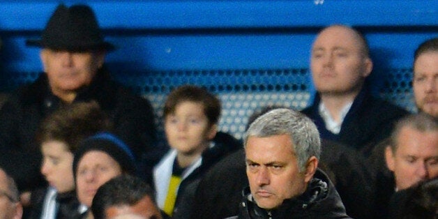 Wilkins (wearing a trilby hat) took his seat among the fans at Stamford Bridge