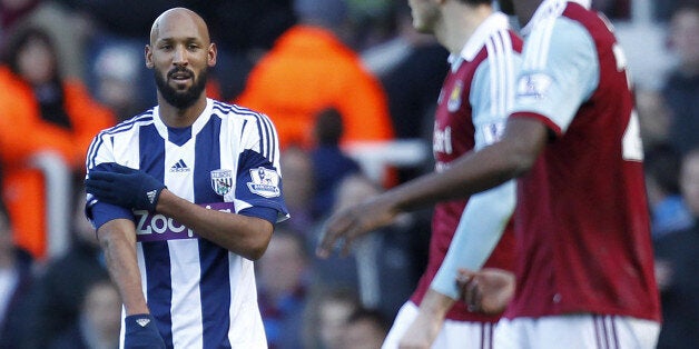 West Bromwich Albion's French striker Nicolas Anelka gestures as he celebrates scoring their second goal during the English Premier League football match between West Ham United and West Bromwich Albion at The Boleyn Ground, Upton Park in east London on December 28, 2013. The game finished 3-3. AFP PHOTO / IAN KINGTONRESTRICTED TO EDITORIAL USE. No use with unauthorized audio, video, data, fixture lists, club/league logos or live services. Online in-match use limited to 45 images, no video emula