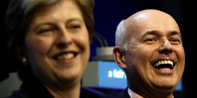 BLACKPOOL, ENGLAND - OCTOBER 6: Theresa May, the Conservative Party Chairman (L) and party leader Iain Duncan Smith laugh at the annual Conservative Party conference October 6, 2003 in Blackpool, England. Duncan Smith has expressed condfidence over the Conservative party's prospects, with polls having the Tories closer to the Labour party than they have been for some time. (Photo by Graeme Robertson/Getty Images)