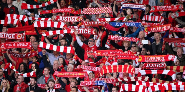 LIVERPOOL, ENGLAND - APRIL 15: Liverpool fans sing 'You'll Never Walk Alone' during the Hillsborough memorial service marking the 25th anniversary of the Hillsborough Disaster at Anfield stadium on April 15, 2014 in Liverpool, England. Thousands of fans, friends and relatives took part in the service at Liverpool's Anfield stadium to mark the 25th anniversary of the Hillsborough disaster. Bells across the City of Liverpool rung during a one minute silence. A total of 96 Liverpool supporters lost their lives during a crush at an FA Cup semi final against Nottingham Forest at the Hillsborough football ground in Sheffield, South Yorkshire in 1989. (Photo by Christopher Furlong/Getty Images)