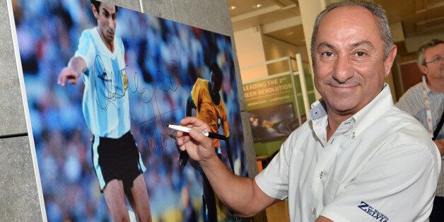 MONACO - OCTOBER 16: Osvaldo Ardiles signs a picture prior to the Golden Foot Award press conference at Grimaldi Forum on October 16, 2013 in Monaco, Monaco. (Photo by Tullio M. Puglia/Getty Images for Golden Foot)