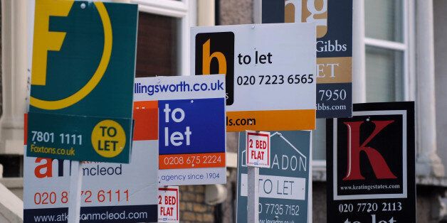 Estate agents boards are seen in Lambeth, London.