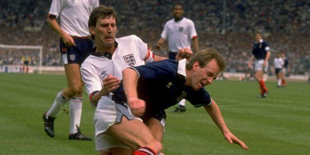 21 May 1988: Bryan Robson of England tackles Paul Simpson of Scotland during the Rous Cup match at Wembley Stadium in London. England won the match 1-0. \ Mandatory Credit: David Cannon/Allsport