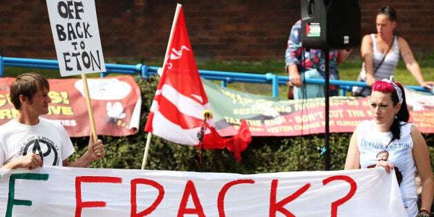 Anti-fracking protesters outside as Prime Minister, David Cameron visits the Wigan Youth Zone boys and girls club.