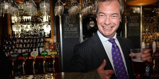 UK Independent Party (UKIP) leader Nigel Farage enjoys a pint of beer in a pub in central London on May 3, 2013. The anti-immigration UK Independence Party (UKIP) was celebrating some of its best ever results following local elections which delivered a bloody nose to Britain's ruling coalition. AFP PHOTO/BEN STANSALL (Photo credit should read BEN STANSALL/AFP/Getty Images)