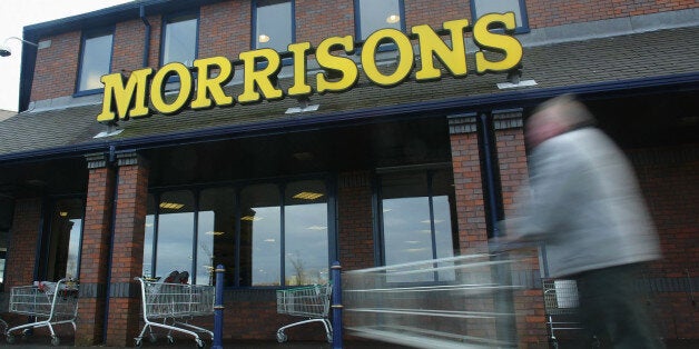 ROCHDALE - JANUARY 9: A shopper pushes his cart outside a Morrisons supermarket January 9, 2003 in Rochdale, Lancashire. The mid-size British supermarket chain, Morrisons, announced its bid to overtake rival Safeway in a 2.9 billion pound deal that would combine the firm with 589 stores and a 16 percent market share. (Photo by Laurence Griffiths/Getty Images)