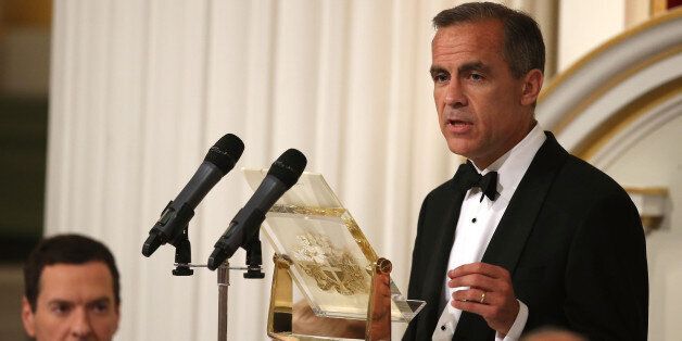 LONDON, ENGLAND - JUNE 12: Mark Carney, Governor of the Bank of England, speaks at the 'Lord Mayor's Dinner to the Bankers and Merchants of the City of London' as Chancellor of the Exchequer, George Osborne, looks on at the Mansion House on June 12, 2014 in London, England. In his keynote speech the Chancellor is announcing new measures to tackle 'the unacceptable behaviour of the few and ensure that markets are fair for the many who depend on them'. (Photo by Peter Macdiarmid - WPA Pool /Getty Images)