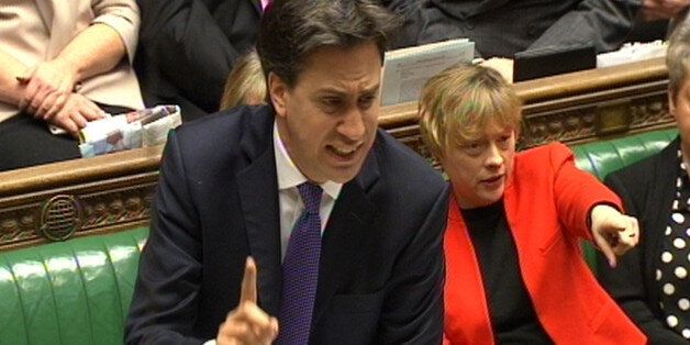 Labour party leader Ed Miliband speaks as Angela Eagle points during Prime Minister's Questions in the House of Commons, London.