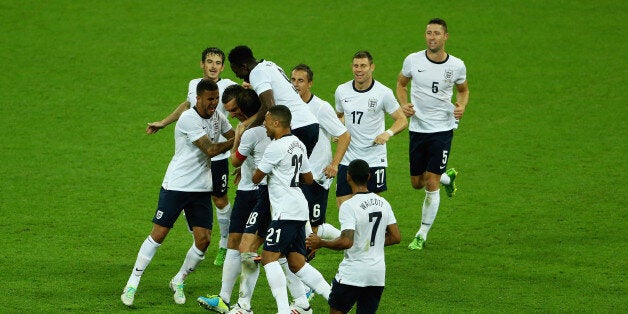 LONDON, ENGLAND - AUGUST 14: Rickie Lambert of England is congratulated on his goal during the International Friendly match between England and Scotland at Wembley Stadium on August 14, 2013 in London, England. (Photo by Matt Lewis - The FA/The FA via Getty Images)
