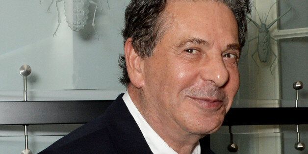 Charles Saatchi has challenged a Spectator columnist to a cage fight