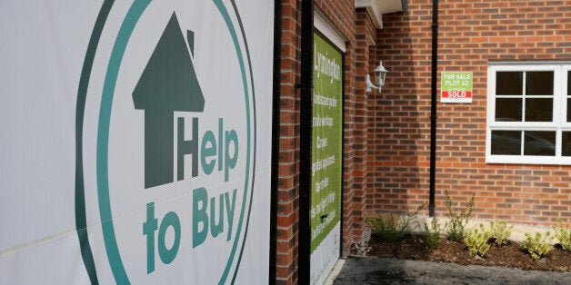 MIDDLEWICH, ENGLAND - MAY 20: Marketing signs adorn the front of new homes on a housing development on May 20, 2014 in Middlewich, England. Official figures have shown that house prices have risen by 8% in the year ending in March. There have been calls by some experts for the UK Help to Buy scheme to be scaled down as it boosts the property market. (Photo by Christopher Furlong/Getty Images)