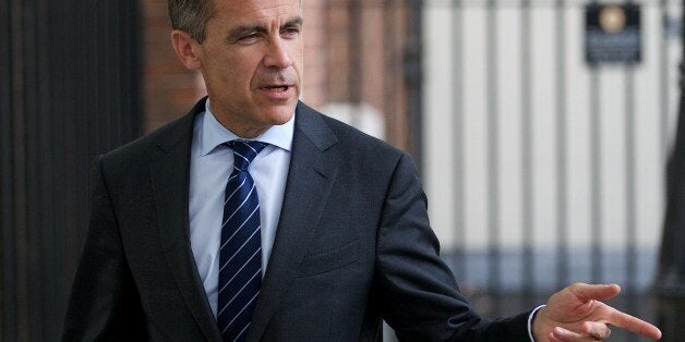 Mark Carney, Governor of the Bank of England leaves number 10 Downing Street after a Global Economy Roundtable meeting in London on June 17, 2014. AFP PHOTO / ANDREW COWIE (Photo credit should read ANDREW COWIE/AFP/Getty Images)