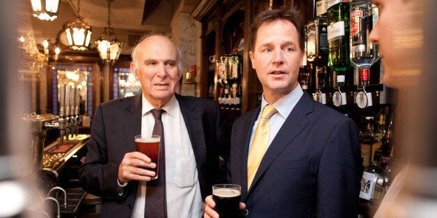 LONDON - JUNE 3: Deputy Prime Minster Nick Clegg shares a pint with Business Secretary Vince Cable, at the Queens Head Pub during a brief visit on June 3, 2014 in Soho, London, England. The pair announced a new code of practice to help Pub landlords. (Photo by Ben Gurr - WPA Pool/Getty Images)