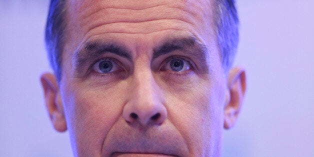 Mark Carney, governor of the Bank of England, pauses during a news conference to announce the results of a public consultation into the use of polymer bank notes, at the central bank in London, U.K., on Wednesday, Dec. 18, 2013. The U.K. will start printing banknotes on plastic instead of cotton paper in 2016 given 'overwhelmingly supportive' public backing for the switch, the Bank of England said today. Photographer: Chris Ratcliffe/Bloomberg via Getty Images