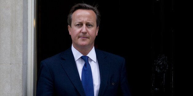 British Prime Minister David Cameron leaves 10 Downing Street in London on 18 June, 2014 preparing to meet Estonian Prime Minister Taavi Roivas. Prime Minister David Cameron warned on June 18 that militants making advances in Iraq and fighting in Syria were also planning to attack Britain. 'I'd disagree with those people who think this is nothing to do with us and if they want to have some sort of extreme Islamist regime in the middle of Iraq that won't affect us -- it will,' Cameron told the House of Commons. He was speaking before chairing a meeting of the government's National Security Council (NSC) on the militant offensive in Iraq, which is being spearheaded by jihadists from the Islamic State of Iraq and the Levant (ISIL). AFP PHOTO / JUSTIN TALLIS (Photo credit should read JUSTIN TALLIS/AFP/Getty Images)