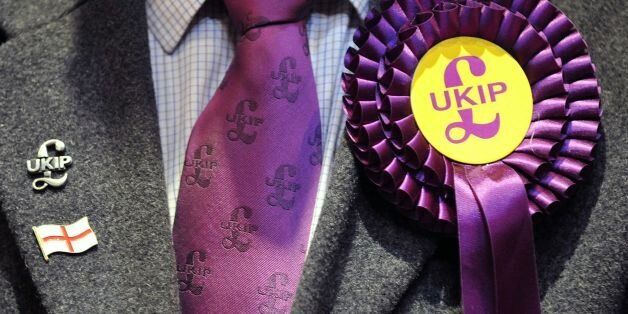 File photo dated 3/5/13 of a UKIP candidate's rosette as Energy Secretary Ed Davey warned today the rise of Ukip risks undermining action on global warming, because of the eurosceptic party's "saloon bar" views on climate change.