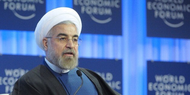 Iranian President Hassan Rouhani addresses the World Economic Forum in Davos on January 23, 2014. Some 40 world leaders gather in the Swiss ski resort Davos to discuss and debate a wide range of issues including the causes of conflicts plaguing the Middle East, and how to reinvigorate the global economy. AFP PHOTO / ERIC PIERMONT (Photo credit should read ERIC PIERMONT/AFP/Getty Images)