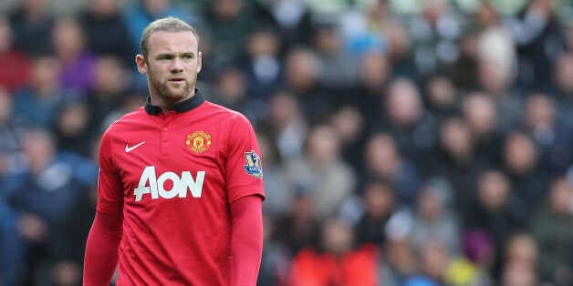 SWANSEA, WALES - AUGUST 17: Wayne Rooney of Manchester United in action during the Barclays Premier League match between Swansea City and Manchester United at the Liberty Stadium on August 17, 2013 in Swansea, Wales. (Photo by John Peters/Man Utd via Getty Images)