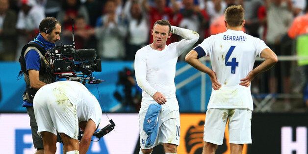 SAO PAULO, BRAZIL - JUNE 19: Wayne Rooney of England looks dejected after a 2-1 defeat in the 2014 FIFA World Cup Brazil Group D match between Uruguay and England at Arena de Sao Paulo on June 19, 2014 in Sao Paulo, Brazil. (Photo by Julian Finney/Getty Images)
