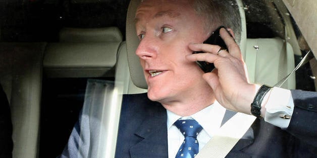 (FILES) Sir Fred Goodwin, Chief-Executive Officer of the Royal Bank of Scotland, speaks on his mobile phone as he leaves the Edinburgh International Conference Centre, on April 23, 2008. Royal Bank of Scotland on Monday October 13, 2008, unveiled plans to raise 20 billion pounds with government help and said its chief executive Fred Goodwin would step down as RBS looks to recover from the credit crunch. AFP PHOTO/ED JONES/FILES (Photo credit should read ED Jones/AFP/Getty Images)