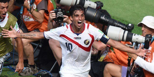 Costa Rica's forward Bryan Ruiz celebrates after scoring his team's first goal during a Group D match between Italy and Costa Rica at the Pernambuco Arena in Recife during the 2014 FIFA World Cup on June 20, 2014. AFP PHOTO / JAVIER SORIANO (Photo credit should read JAVIER SORIANO/AFP/Getty Images)