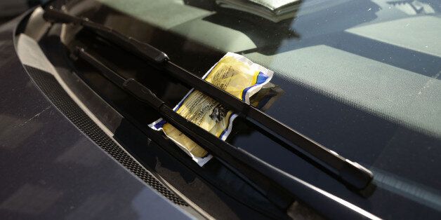 A parking ticket on a car windscreen in Westminster, central London.
