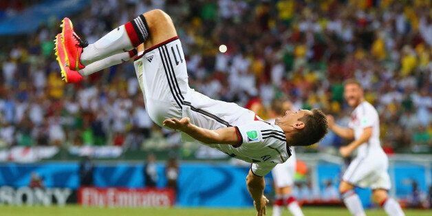 FORTALEZA, BRAZIL - JUNE 21: Miroslav Klose of Germany does a flip in celebration of scoring his team's second goal during the 2014 FIFA World Cup Brazil Group G match between Germany and Ghana at Castelao on June 21, 2014 in Fortaleza, Brazil. (Photo by Martin Rose/Getty Images)