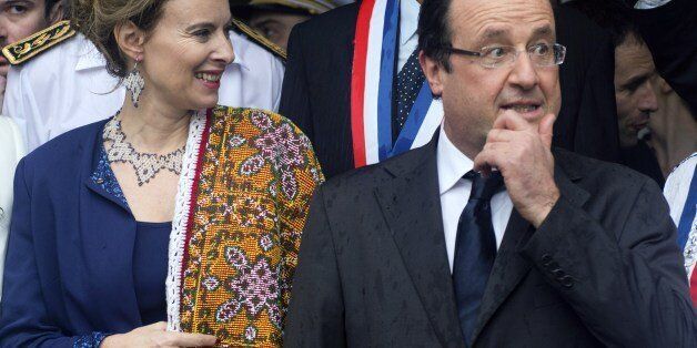 France's President Francois Hollande (R) and his companion Valerie Trierweiller attend an event in Mana, in the French oversees territory of Guiana, on December 14, 2013. AFP PHOTO/ ALAIN JOCARD (Photo credit should read ALAIN JOCARD/AFP/Getty Images)