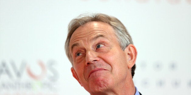 Tony Blair, former U.K. prime minister, reacts during a news conference on day two of the World Economic Forum (WEF) in Davos, Switzerland, on Thursday, Jan. 23, 2014. World leaders, influential executives, bankers and policy makers attend the 44th annual meeting of the World Economic Forum in Davos, the five day event runs from Jan. 22-25. Photographer: Chris Ratcliffe/Bloomberg via Getty Images