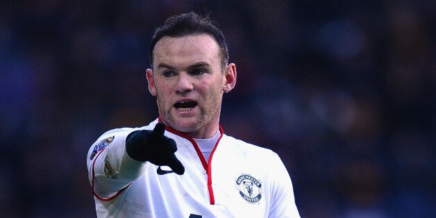 HULL, ENGLAND - DECEMBER 26: Wayne Rooney of Manchester United looks on during the Barclays Premier League match between Hull City and Manchester United at KC Stadium on December 26, 2013 in Hull, England. (Photo by Laurence Griffiths/Getty Images)